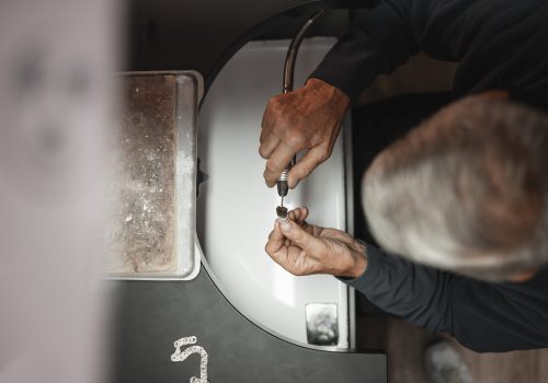 male-jeweler-working-shop