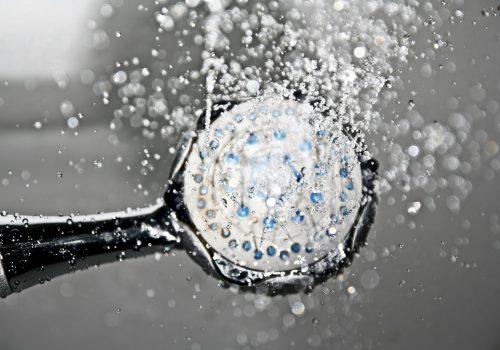 shower-shower-head-water-drop-of-water-161502-161502 Close-up of a shower head releasing water droplets, creating a crisp and refreshing bathroom scene.